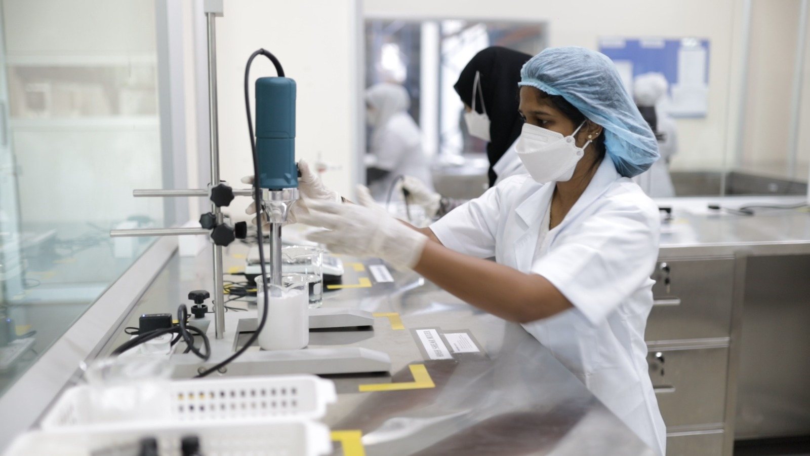 Formulation lab technician developing cosmetic formula