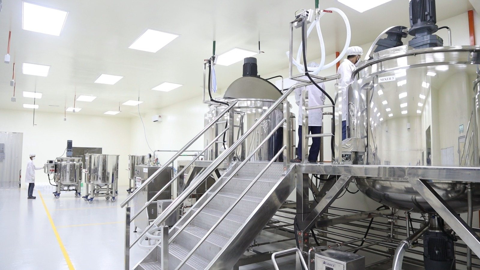 Stainless steel mixing tanks on the manufacturing floor